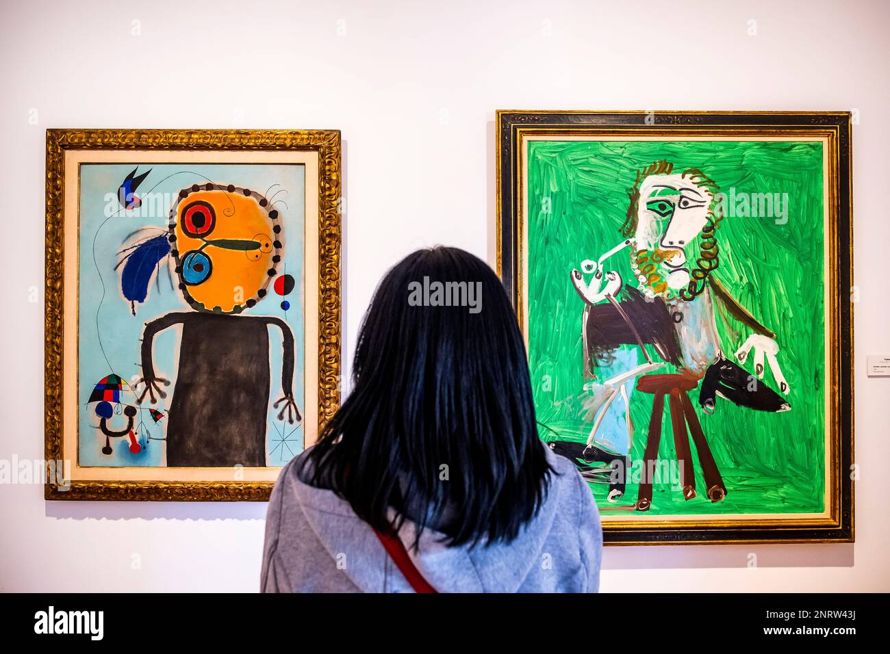 At left `el disco rojo persiguiendo a la alondra´by Joan Miró. At right `Hombre sentado con pipa´by Pablo Picasso, Botero Museum, Bogota, Colombia Stock Photo